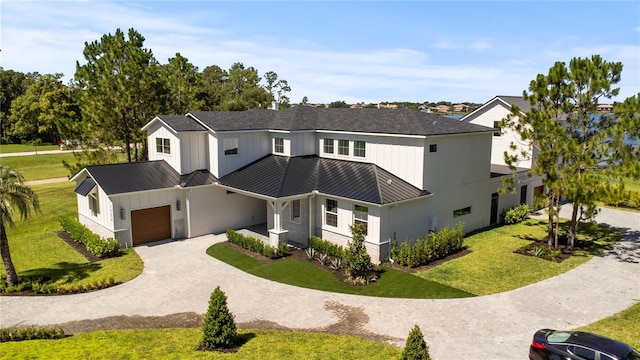 7706 Ficquette Rd, Windermere, FL 34786 - modern farmhouse featuring a standing seam roof, a metal roof, and an attached garage