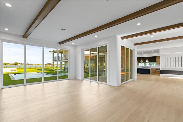 7706 Ficquette Rd, Windermere, FL 34786 - empty room featuring beam ceiling, light wood-type flooring, and recessed lighting