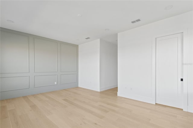7706 Ficquette Rd, Windermere, FL 34786 - unfurnished bedroom with light wood-type flooring and baseboards