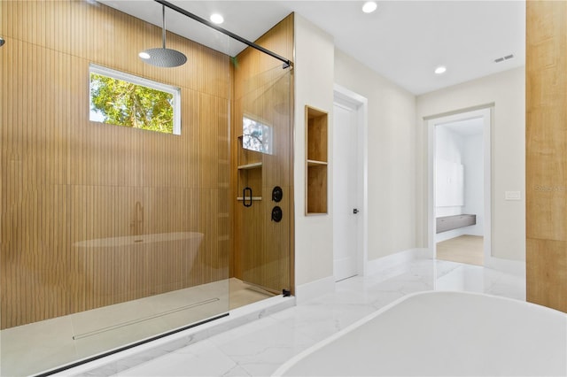 7706 Ficquette Rd, Windermere, FL 34786 - bathroom with a freestanding bath, a shower stall, recessed lighting, and marble finish flooring