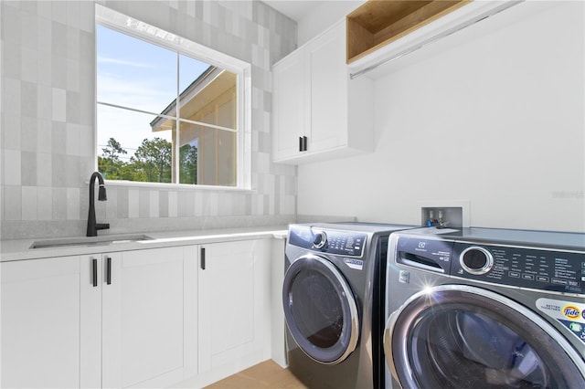 7706 Ficquette Rd, Windermere, FL 34786 - laundry area with cabinet space and washing machine and dryer