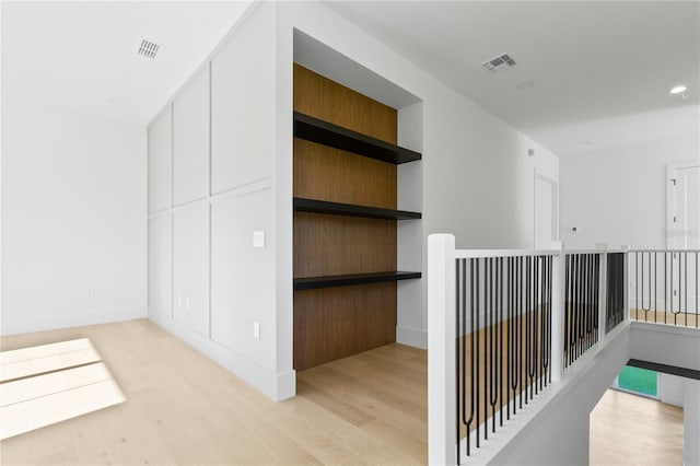 7706 Ficquette Rd, Windermere, FL 34786 - corridor with light wood-style floors and recessed lighting