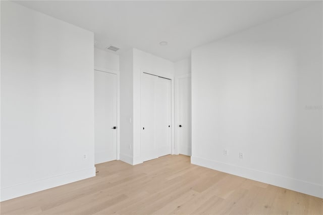 7706 Ficquette Rd, Windermere, FL 34786 - empty room with light wood-style flooring