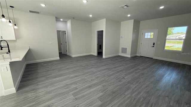 285 Marion Oaks Crse, Ocala, FL 34473 - unfurnished living room with recessed lighting, dark wood-style floors, baseboards, and a sink