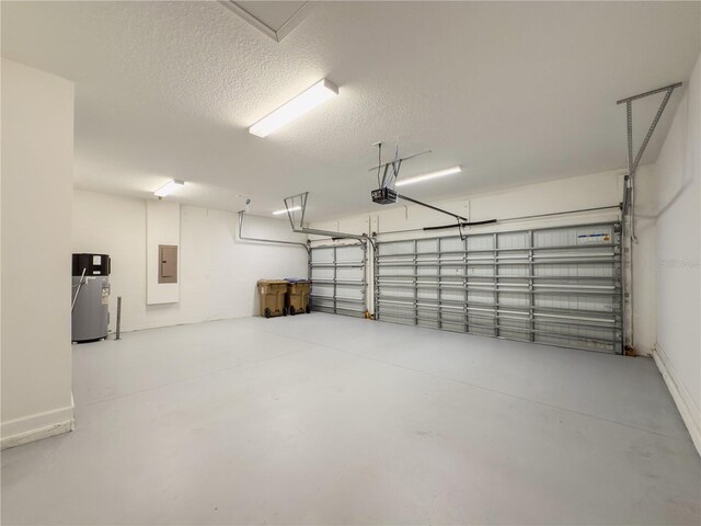 4632 Egg Harbor Dr, Kissimmee, FL 34746 - garage with water heater, electric panel, and a garage door opener