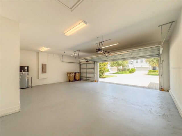 4632 Egg Harbor Dr, Kissimmee, FL 34746 - garage featuring electric panel, water heater, and a garage door opener