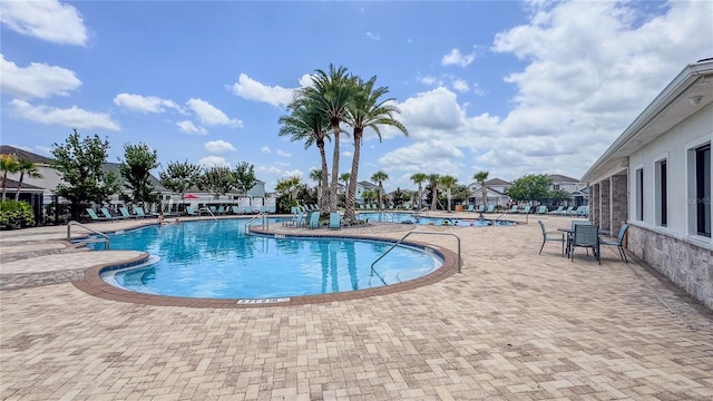 4632 Egg Harbor Dr, Kissimmee, FL 34746 - community pool featuring a patio area