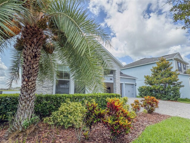 4632 Egg Harbor Dr, Kissimmee, FL 34746 - view of front of property with a garage, driveway, and stucco siding