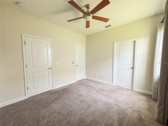 4632 Egg Harbor Dr, Kissimmee, FL 34746 - unfurnished bedroom with carpet flooring, baseboards, and a ceiling fan