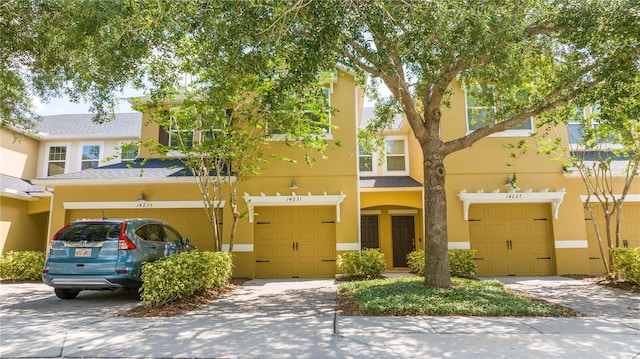 14231 Desert Haven St Unit Ge, Windermere, FL 34786 - multi unit property featuring stucco siding and an attached garage