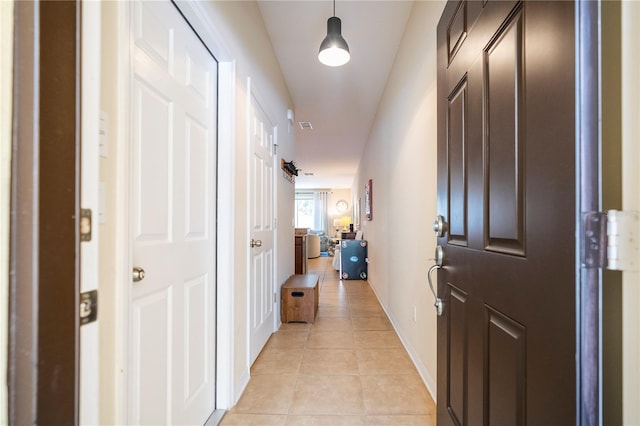 14231 Desert Haven St Unit Ge, Windermere, FL 34786 - corridor featuring light tile patterned flooring and baseboards