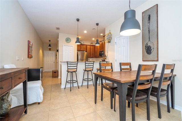 14231 Desert Haven St Unit Ge, Windermere, FL 34786 - dining area with light tile patterned floors, recessed lighting, and baseboards