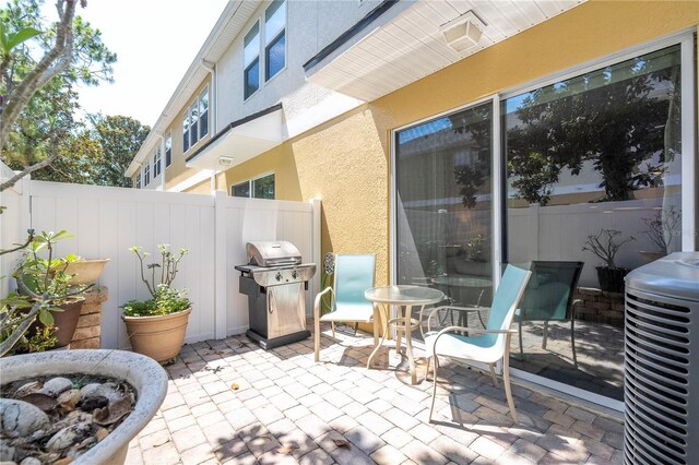 14231 Desert Haven St Unit Ge, Windermere, FL 34786 - view of patio with area for grilling and cooling unit