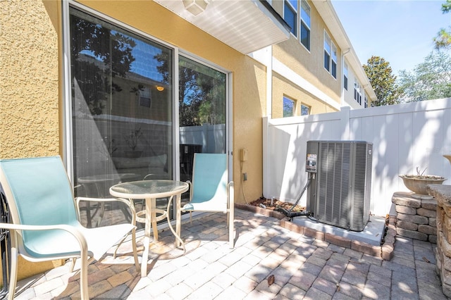 14231 Desert Haven St Unit Ge, Windermere, FL 34786 - view of patio / terrace featuring central air condition unit
