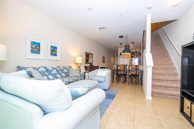 14231 Desert Haven St Unit Ge, Windermere, FL 34786 - living room with stairway, light tile patterned floors, and baseboards