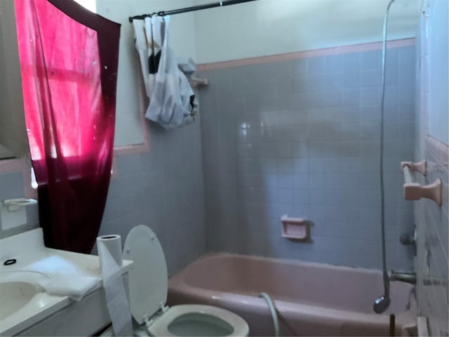 58 W 27th St Unit N, West Palm Beach, FL 33404 - bathroom featuring toilet, vanity, and bathing tub / shower combination