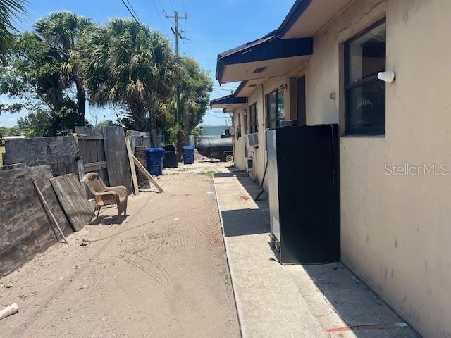 58 W 27th St Unit N, West Palm Beach, FL 33404 - view of property exterior featuring stucco siding and a patio