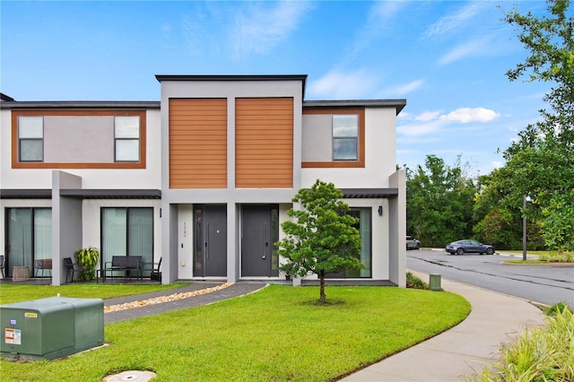 3301 Tranquil Trl, Kissimmee, FL 34747 - back of house featuring stucco siding and a yard