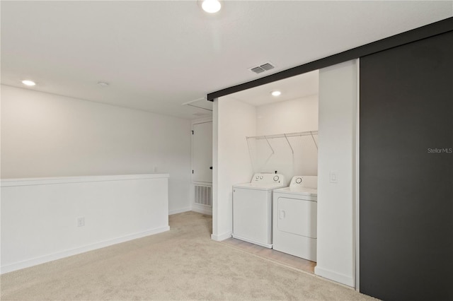 3301 Tranquil Trl, Kissimmee, FL 34747 - washroom with washer and dryer, light carpet, recessed lighting, and attic access