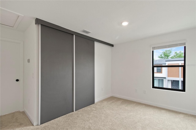 3301 Tranquil Trl, Kissimmee, FL 34747 - unfurnished bedroom featuring light colored carpet and a closet
