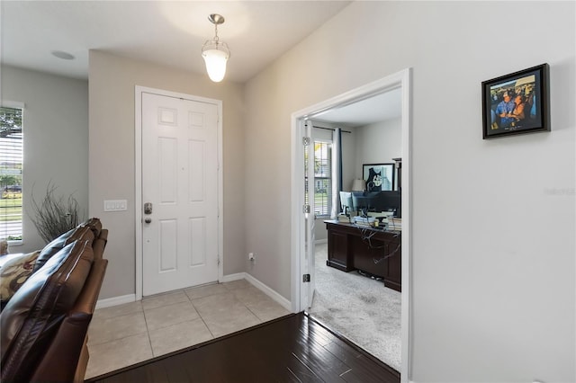5217 Creekside Park Ave, Orlando, FL 32811 - entryway with plenty of natural light, light wood-type flooring, and baseboards