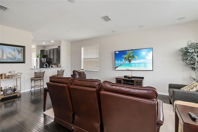 5217 Creekside Park Ave, Orlando, FL 32811 - living area with baseboards, dark wood-style floors, and recessed lighting