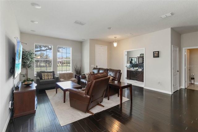 5217 Creekside Park Ave, Orlando, FL 32811 - living area featuring baseboards and wood finished floors