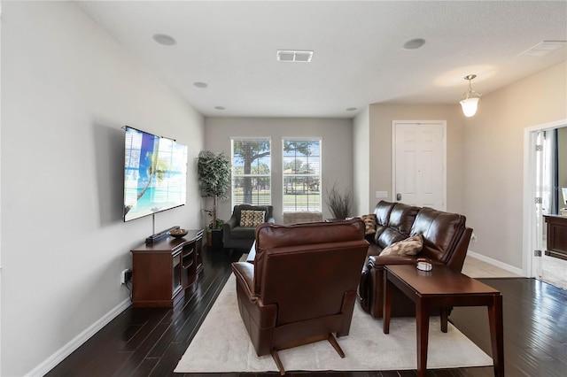 5217 Creekside Park Ave, Orlando, FL 32811 - living area with dark wood-type flooring and baseboards