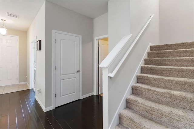 5217 Creekside Park Ave, Orlando, FL 32811 - stairway with wood finished floors and baseboards