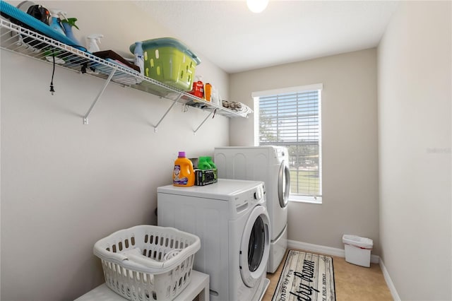 5217 Creekside Park Ave, Orlando, FL 32811 - laundry room with independent washer and dryer and baseboards
