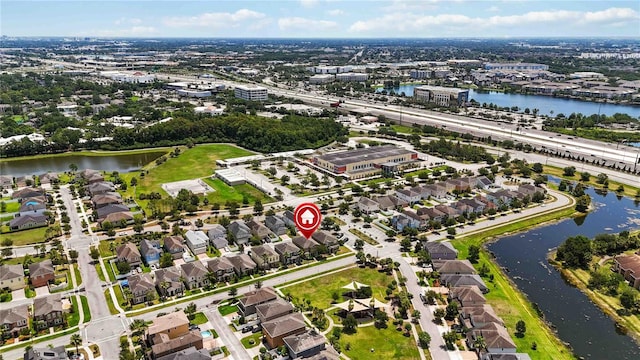 5217 Creekside Park Ave, Orlando, FL 32811 - aerial view of property and surrounding area featuring a large body of water and nearby suburban area