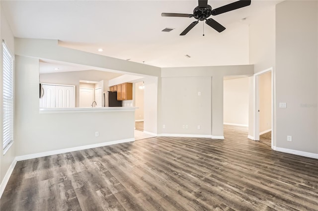 4305 Balmoral Ct, Wesley Chapel, FL 33543 - unfurnished living room featuring a ceiling fan, wood finished floors, baseboards, lofted ceiling, and recessed lighting