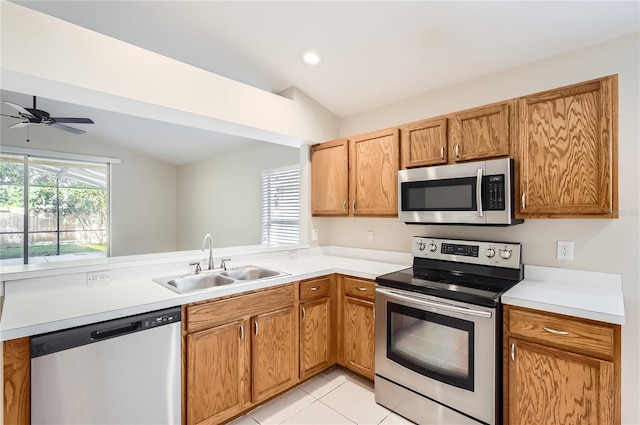 4305 Balmoral Ct, Wesley Chapel, FL 33543 - kitchen with appliances with stainless steel finishes, a sink, light countertops, and ceiling fan