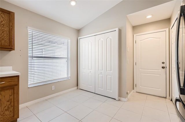 4305 Balmoral Ct, Wesley Chapel, FL 33543 - unfurnished bedroom with baseboards, a closet, vaulted ceiling, light tile patterned floors, and recessed lighting