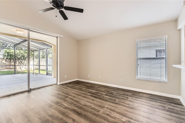 4305 Balmoral Ct, Wesley Chapel, FL 33543 - unfurnished room featuring dark wood-style flooring, vaulted ceiling, baseboards, and a ceiling fan