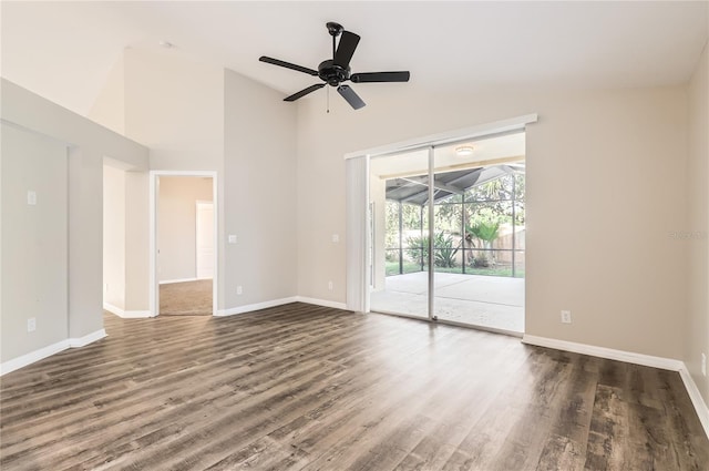 4305 Balmoral Ct, Wesley Chapel, FL 33543 - spare room with baseboards, wood finished floors, and high vaulted ceiling