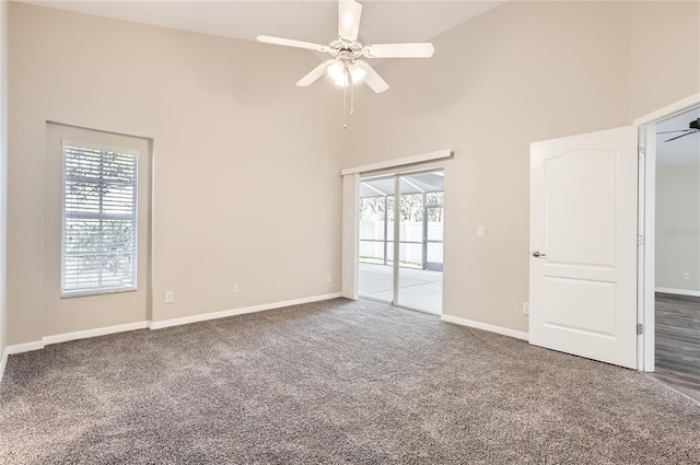 4305 Balmoral Ct, Wesley Chapel, FL 33543 - carpeted empty room with a towering ceiling, ceiling fan, and baseboards