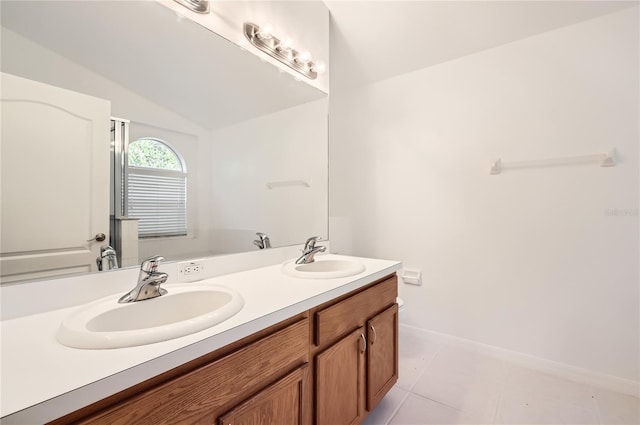 4305 Balmoral Ct, Wesley Chapel, FL 33543 - full bathroom featuring double vanity, baseboards, lofted ceiling, and tile patterned floors