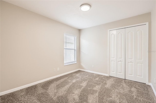 4305 Balmoral Ct, Wesley Chapel, FL 33543 - unfurnished bedroom with carpet, baseboards, and a closet