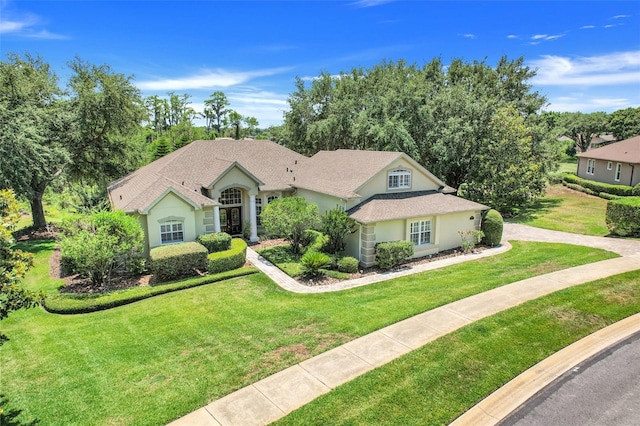 11602 Graces Way, Clermont, FL 34711 - view of front of property with a front yard and stucco siding
