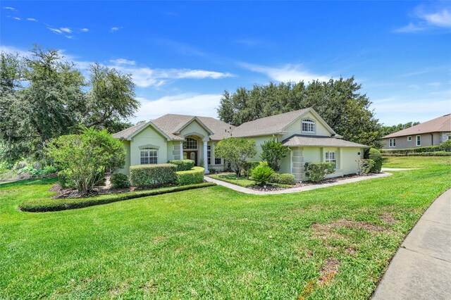 11602 Graces Way, Clermont, FL 34711 - single story home with a front yard and stucco siding