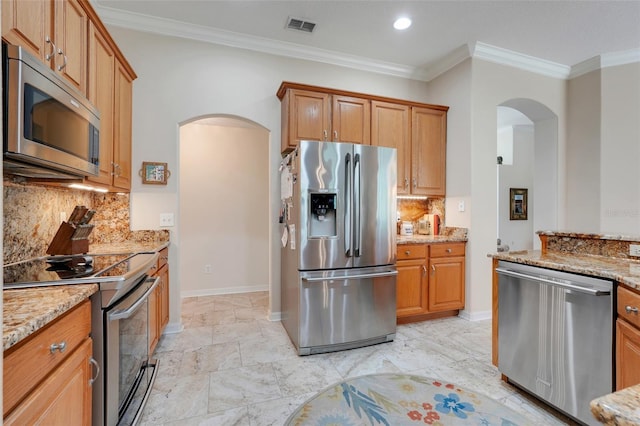 11602 Graces Way, Clermont, FL 34711 - kitchen with stainless steel appliances, arched walkways, light stone countertops, ornamental molding, and tasteful backsplash