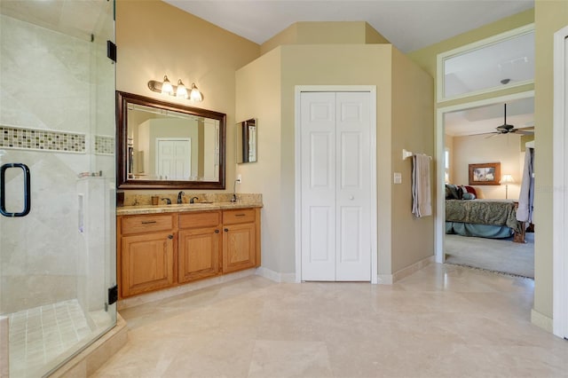 11602 Graces Way, Clermont, FL 34711 - ensuite bathroom featuring ceiling fan, a stall shower, vanity, a closet, and baseboards