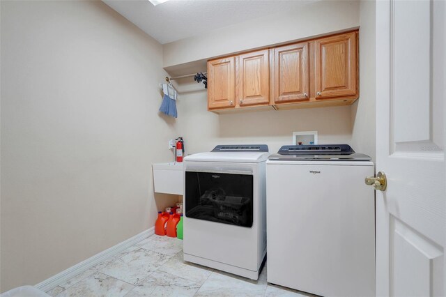 11602 Graces Way, Clermont, FL 34711 - washroom with washer and dryer, baseboards, cabinet space, and light marble finish floors