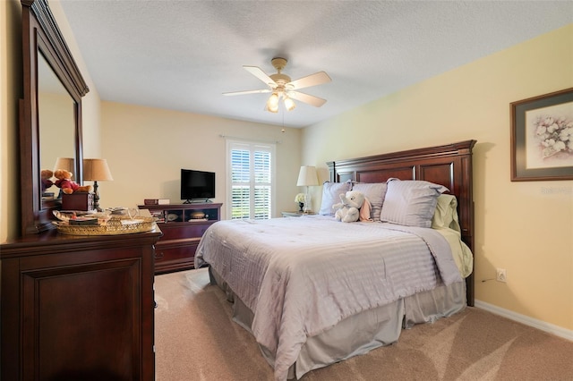 11602 Graces Way, Clermont, FL 34711 - bedroom with light colored carpet, baseboards, a ceiling fan, and a textured ceiling