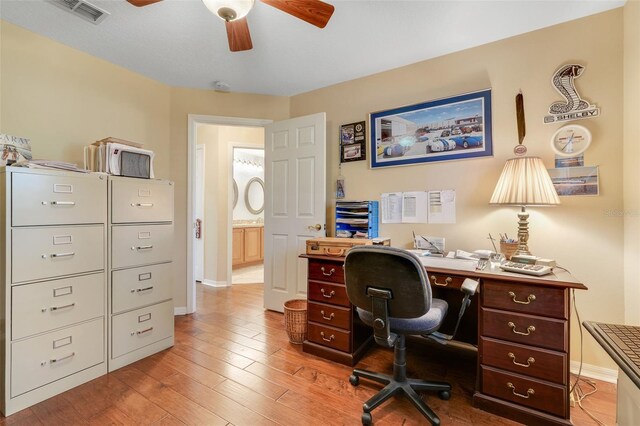 11602 Graces Way, Clermont, FL 34711 - office space featuring a ceiling fan, baseboards, and light wood finished floors