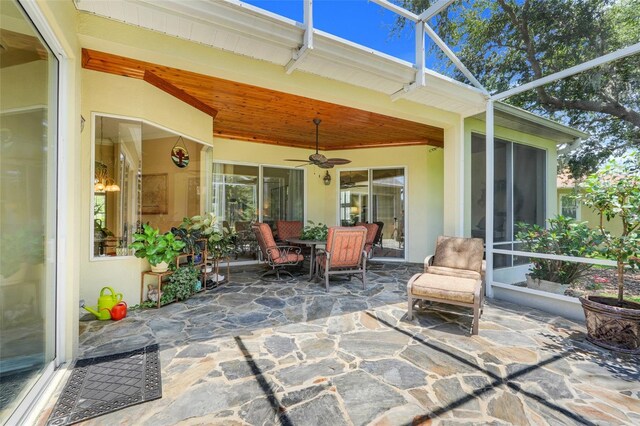 11602 Graces Way, Clermont, FL 34711 - sunroom with a ceiling fan and outdoor dining area