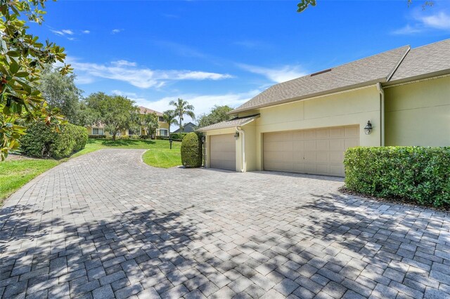 11602 Graces Way, Clermont, FL 34711 - garage with decorative driveway