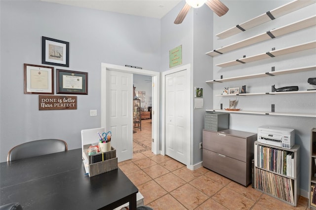 17523 Doris St, Montverde, FL 34756 - home office featuring light tile patterned floors, a towering ceiling, and a ceiling fan