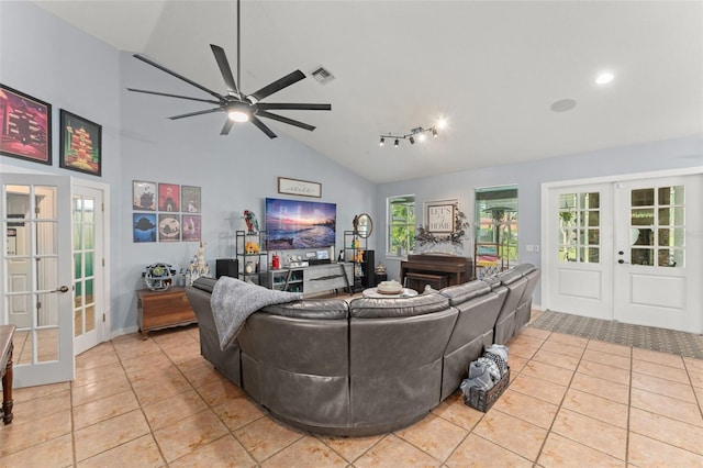 17523 Doris St, Montverde, FL 34756 - living room with french doors, light tile patterned floors, a ceiling fan, high vaulted ceiling, and baseboards